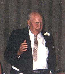 Joseph F. Schulte telling a story at his 50th wedding celebration - 1971